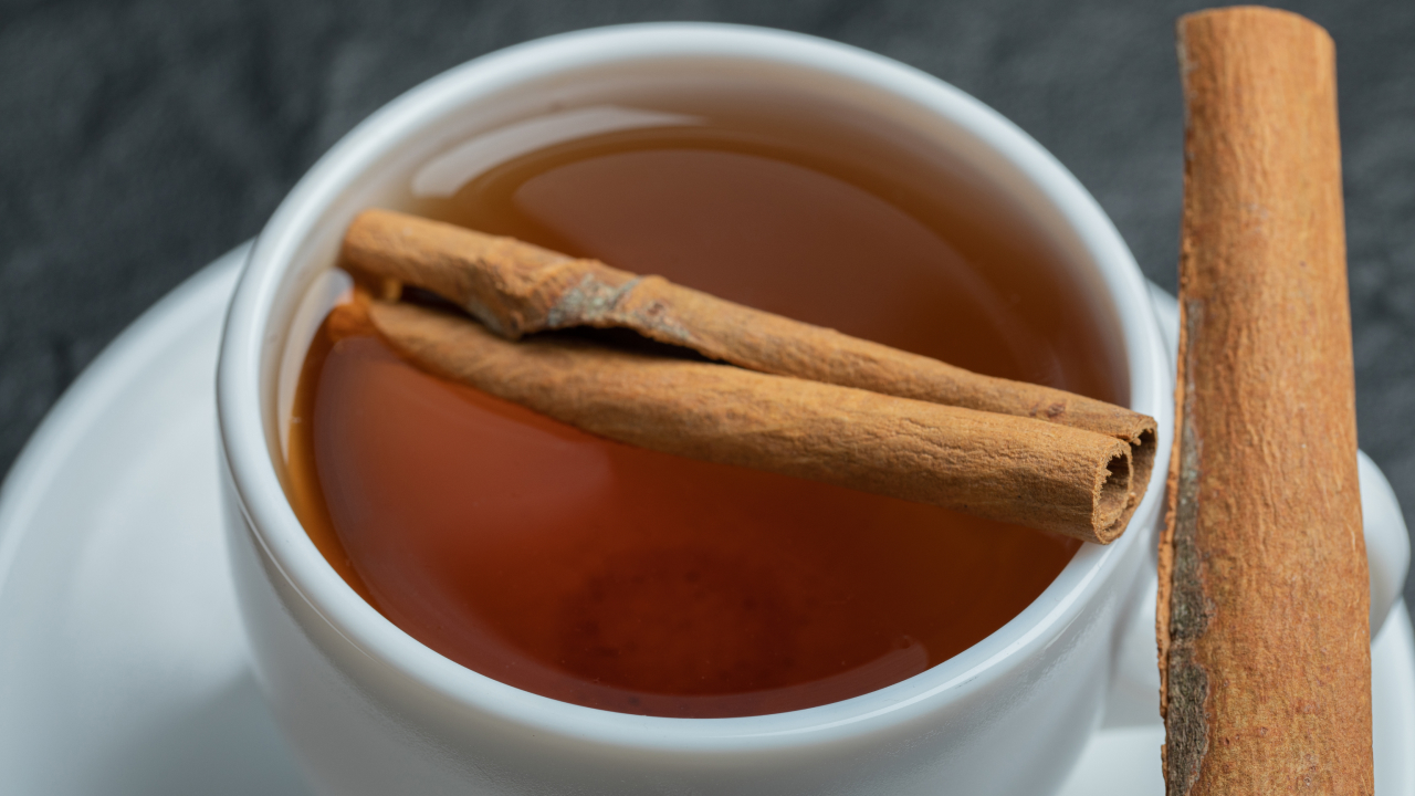 A cup of tea with cinnamon sticks