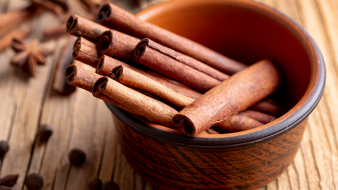 A bowl filled with cinnamon sticks