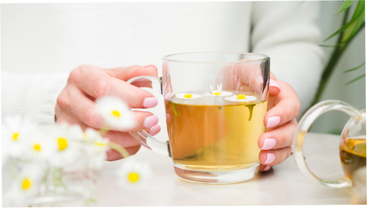 A woman holding detox tea 
